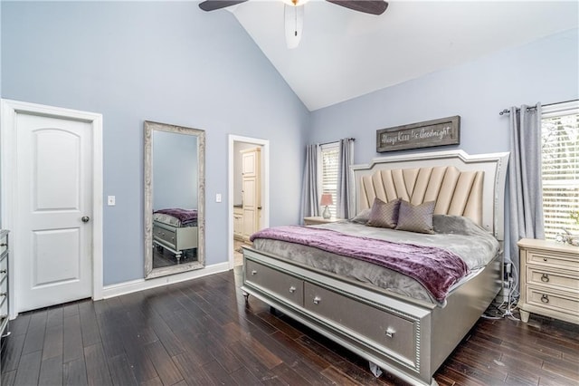 bedroom with ceiling fan, high vaulted ceiling, dark hardwood / wood-style flooring, and ensuite bath