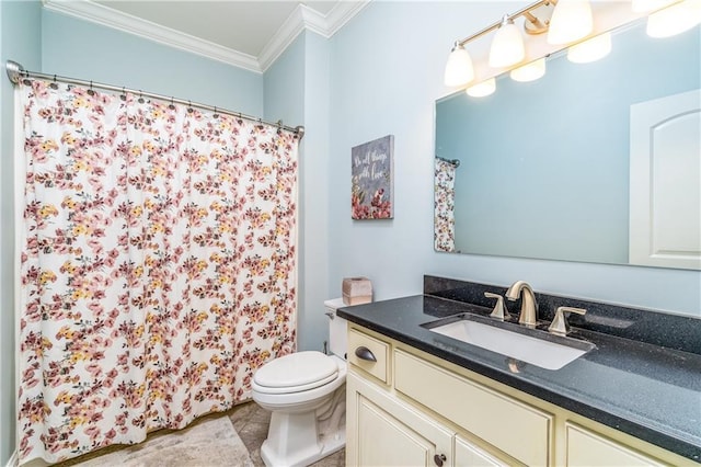 bathroom with crown molding, vanity, and toilet