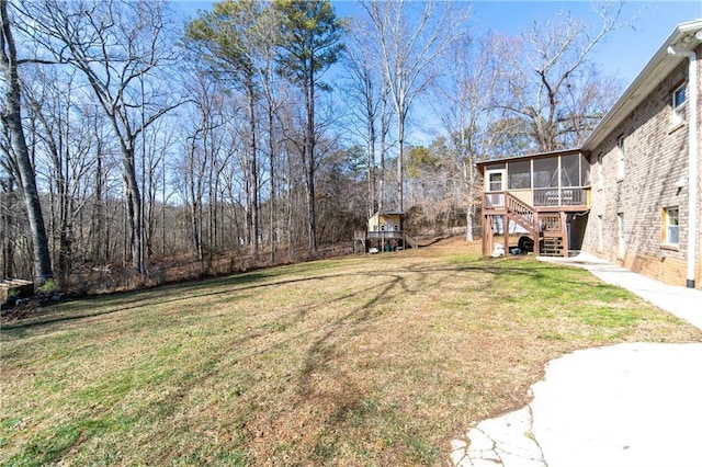 view of yard featuring a sunroom