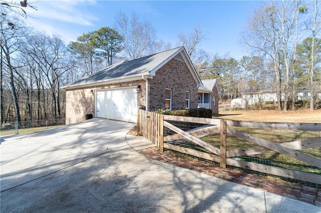 view of side of property featuring a garage