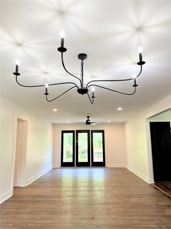 unfurnished room featuring hardwood / wood-style flooring