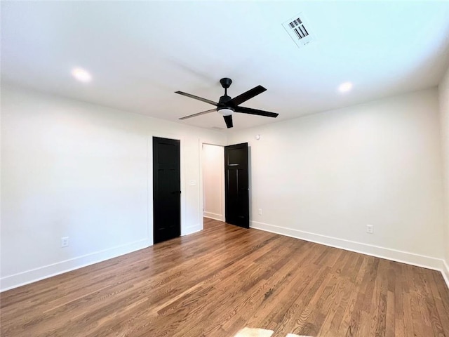 unfurnished bedroom featuring ceiling fan and hardwood / wood-style floors