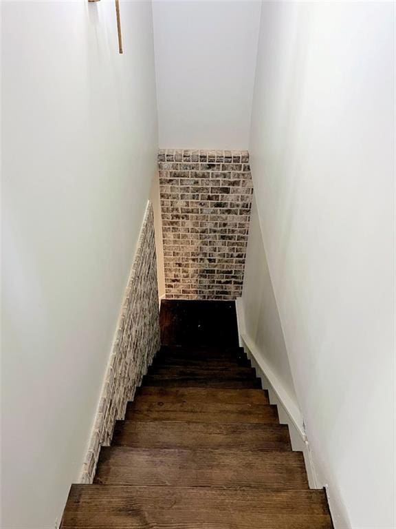 stairway with hardwood / wood-style floors