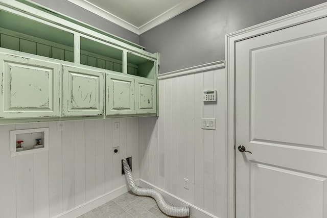 clothes washing area featuring washer hookup, ornamental molding, cabinet space, and electric dryer hookup