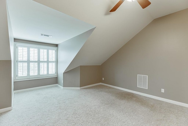 bonus room with a ceiling fan, visible vents, carpet floors, and baseboards