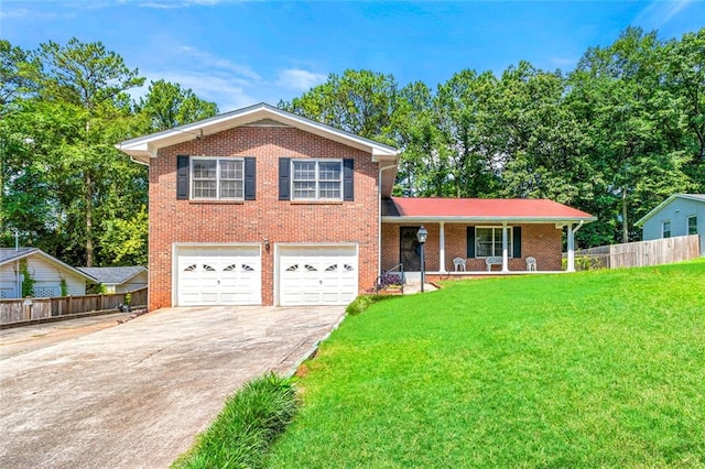 2117 Chestnut Hill Cir, Decatur, GA 30032 - tri-level home featuring driveway, brick siding, covered porch, and a garage