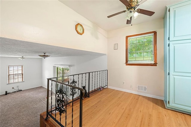 2117 Chestnut Hill Cir, Decatur, GA 30032 - hallway with plenty of natural light, an upstairs landing, and light wood-style flooring