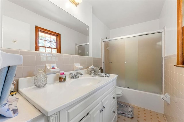 2117 Chestnut Hill Cir, Decatur, GA 30032 - bathroom featuring tile walls, vanity, and shower / bath combination with glass door