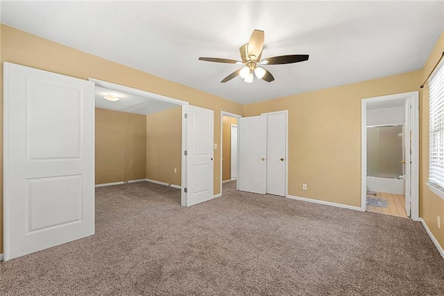 2117 Chestnut Hill Cir, Decatur, GA 30032 - unfurnished bedroom with carpet, connected bathroom, and a ceiling fan