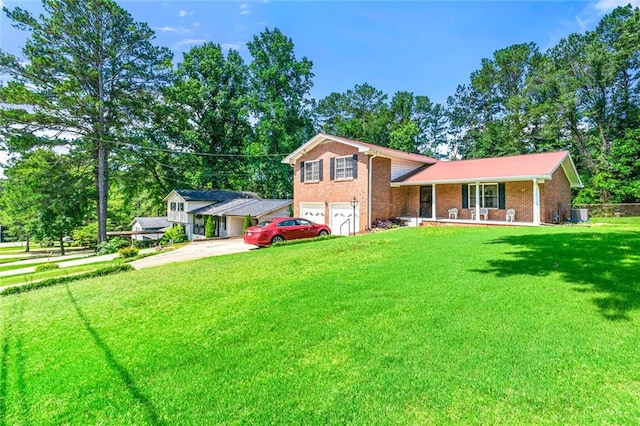 2117 Chestnut Hill Cir, Decatur, GA 30032 - tri-level home featuring covered porch, an attached garage, concrete driveway, and brick siding