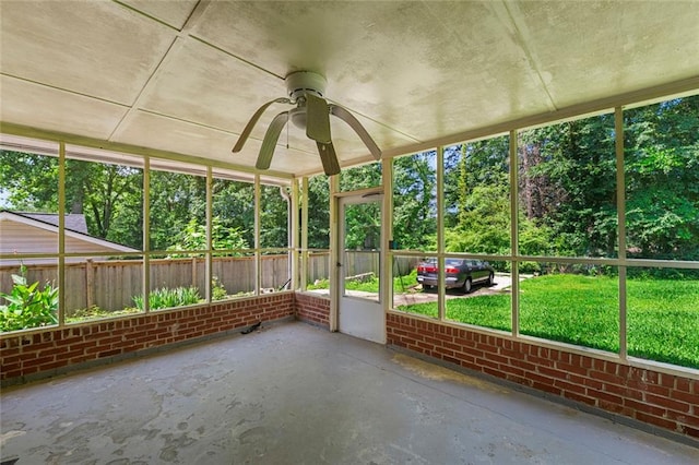 2117 Chestnut Hill Cir, Decatur, GA 30032 - unfurnished sunroom featuring ceiling fan and view of wooded area