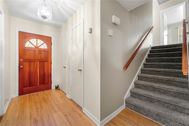 2117 Chestnut Hill Cir, Decatur, GA 30032 - entryway featuring stairs and light wood-style flooring