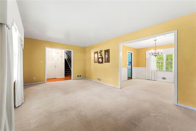 2117 Chestnut Hill Cir, Decatur, GA 30032 - unfurnished room with a chandelier, stairs, and carpet floors