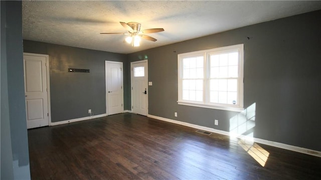 entryway with ceiling fan, wood finished floors, and baseboards