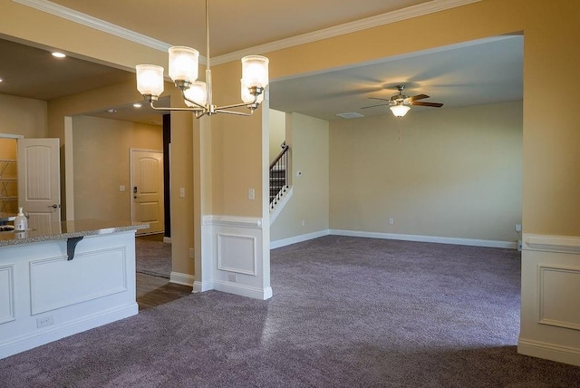 spare room with stairway, baseboards, dark carpet, and crown molding