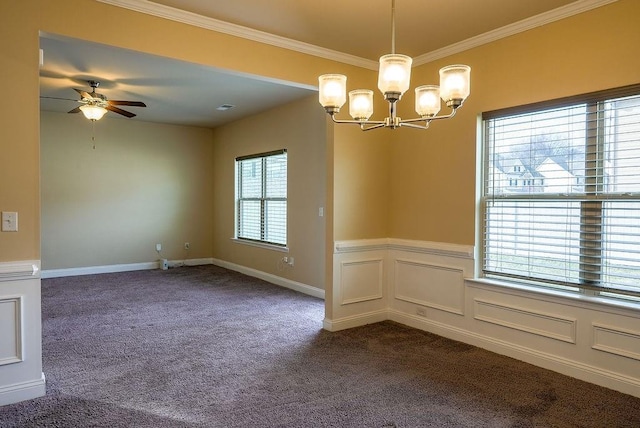 spare room with a wainscoted wall, dark colored carpet, ornamental molding, and a decorative wall