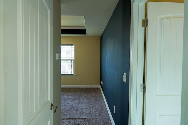 hall with carpet and baseboards