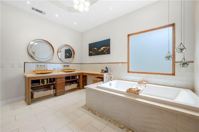 full bathroom with a garden tub, tile patterned flooring, double vanity, and recessed lighting