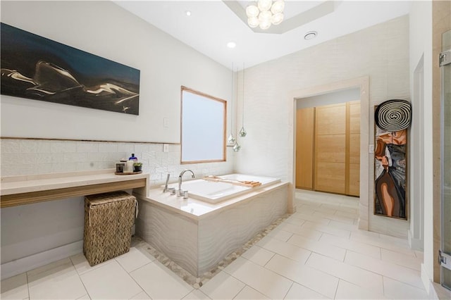 bathroom featuring a bath, a chandelier, tile patterned floors, and recessed lighting