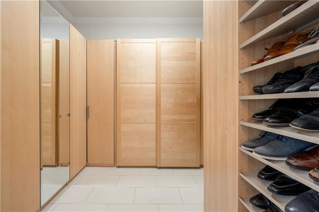 spacious closet featuring light tile patterned floors