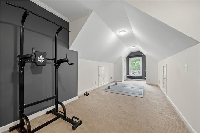 workout area with carpet flooring, baseboards, and vaulted ceiling
