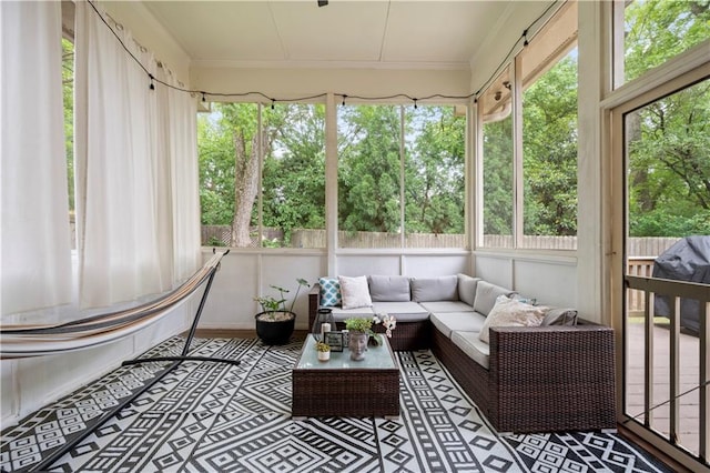 sunroom / solarium featuring outdoor lounge area