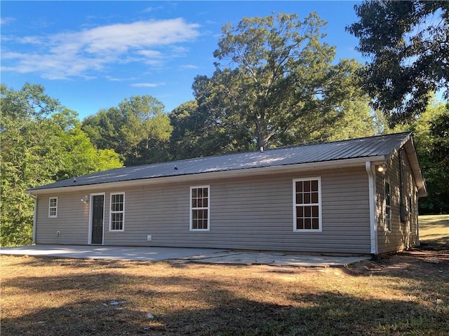 rear view of house with a patio