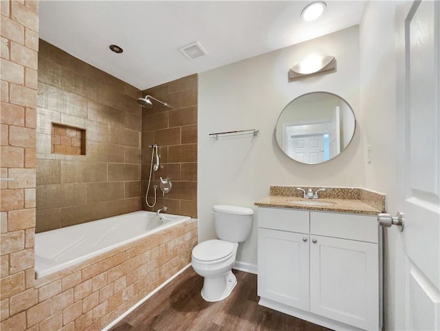 89 Elsberry Rd, Dallas, GA 30157 - full bathroom with wood finished floors, toilet, tiled shower / bath, vanity, and baseboards
