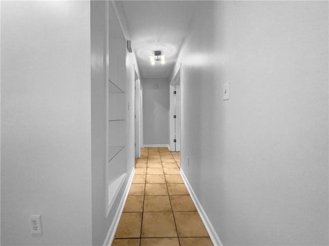 hallway featuring light tile patterned floors