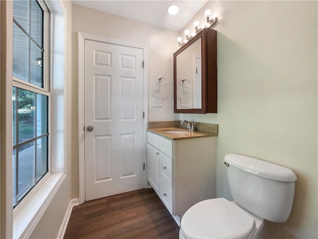 89 Elsberry Rd, Dallas, GA 30157 - half bath featuring wood finished floors, toilet, vanity, and baseboards