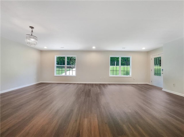 89 Elsberry Rd, Dallas, GA 30157 - unfurnished room featuring dark wood-style flooring, a chandelier, healthy amount of natural light, baseboards, and recessed lighting