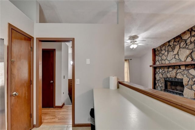 hallway featuring light tile patterned floors