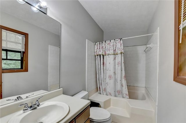 full bathroom with vanity, lofted ceiling, a textured ceiling, shower / tub combo, and toilet