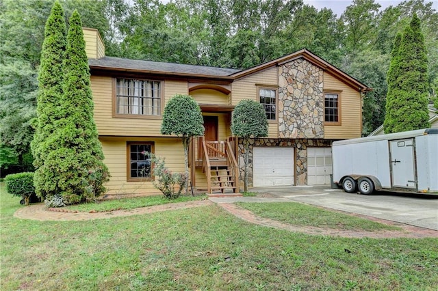 bi-level home featuring a front lawn and a garage