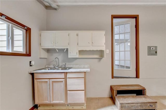 kitchen with sink and light tile patterned floors