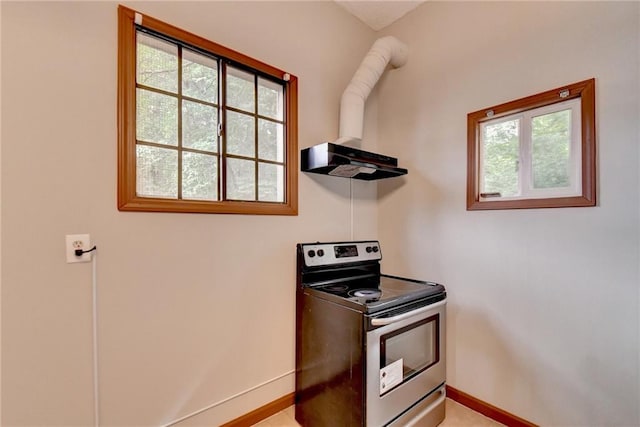 kitchen featuring a healthy amount of sunlight and stainless steel electric range oven