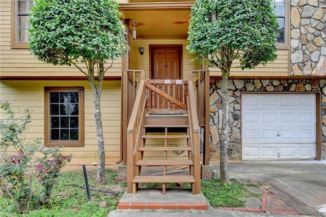 doorway to property featuring a garage