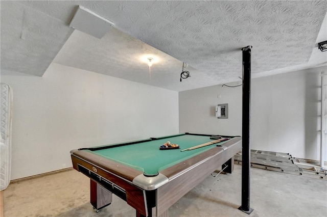 recreation room featuring a textured ceiling, pool table, and electric panel