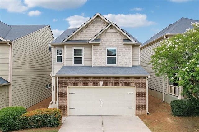 503 Mill Ridge Rd, Woodstock, GA 30188 - view of front of property featuring concrete driveway, an attached garage, brick siding, and roof with shingles