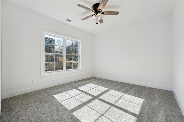 empty room with ceiling fan and carpet flooring