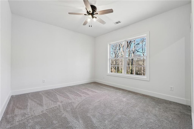 spare room with carpet flooring and ceiling fan