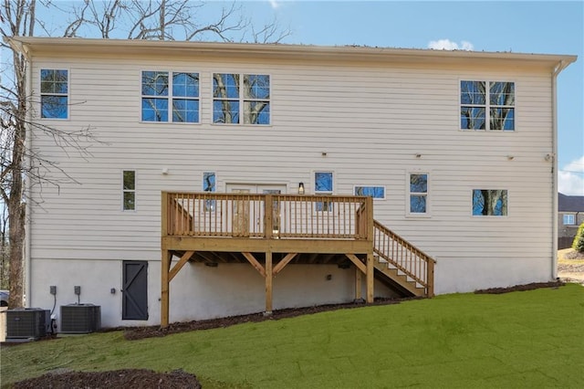 back of house with a wooden deck, a yard, and cooling unit