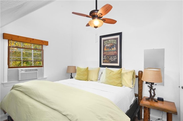 bedroom with ceiling fan, vaulted ceiling, and cooling unit