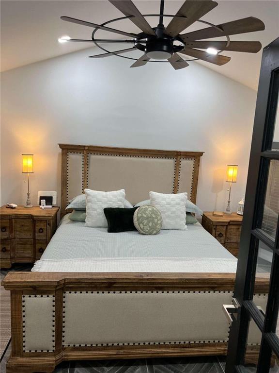 bedroom featuring vaulted ceiling and ceiling fan