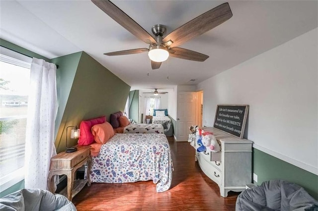 bedroom featuring ceiling fan and wood finished floors