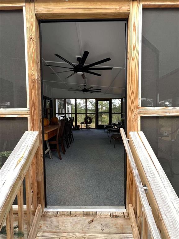 sunroom with a ceiling fan