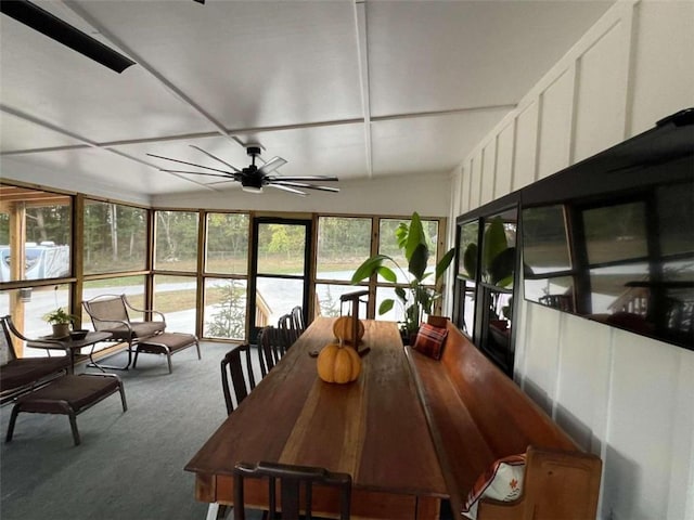 sunroom / solarium featuring ceiling fan