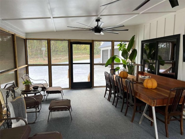 sunroom / solarium featuring ceiling fan