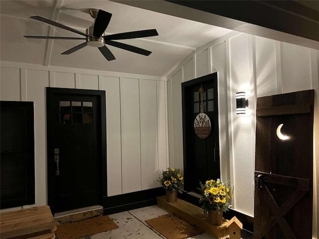 entrance to property featuring ceiling fan