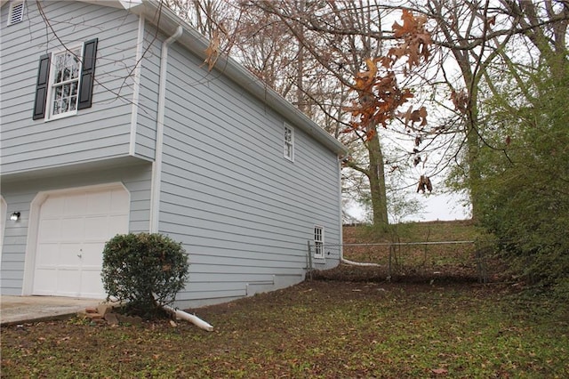 view of property exterior with a garage